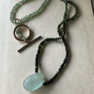 14K yellow gold green tourmaline ombré necklace with a large aquamarine pendant